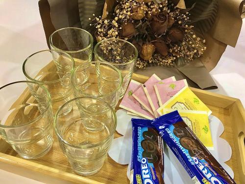 a tray with four empty glasses on a table at Taman Air Lagoon Resort at A921, unlimited waterpark access, Melaka in Melaka