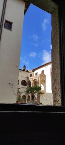 a view of a building from a window at Dormire nel Castello in Pitigliano