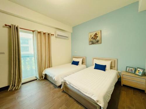 Cama o camas de una habitación en 時光旅舍新館