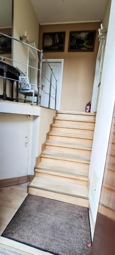 a staircase in a room with a stair case at 5 Stars High Hostel in Bucharest