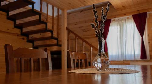 a glass vase sitting on a table in a room at Tusnad Camping in Băile Tuşnad
