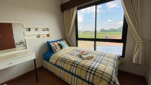 Postel nebo postele na pokoji v ubytování AMAZ Bed & Cafe