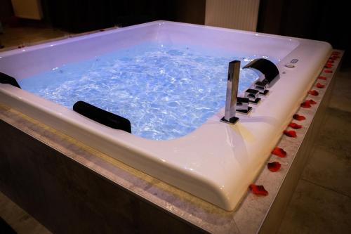 a cake shaped like a bath tub with a faucet at LE LOFT A BULLES (85m2 Jacuzzi Hammam Billiard Bar Douche Sauna) in Strasbourg