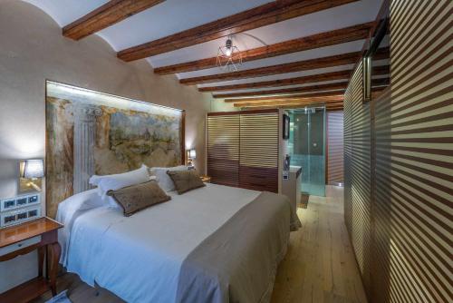Postel nebo postele na pokoji v ubytování El Palacio de Argensola by Alogest