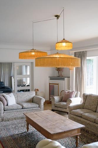 a living room with two couches and a table at Edville Home in Ghent
