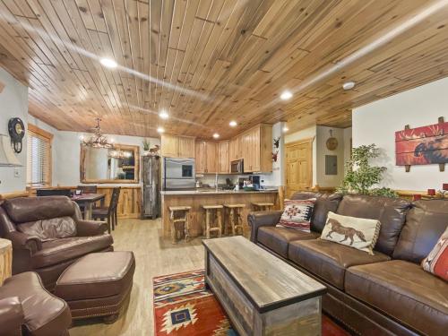 a living room with a couch and a table at Timberwolf Lodge 6 cabin in Park City