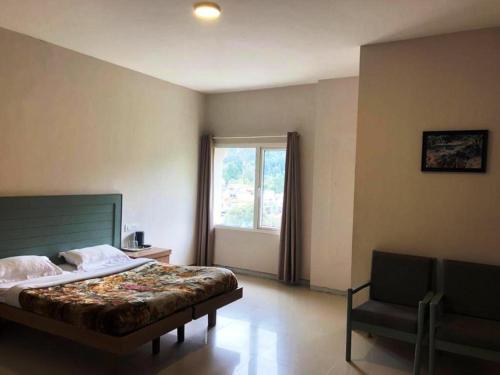 Postel nebo postele na pokoji v ubytování Hotel Preethi Palace