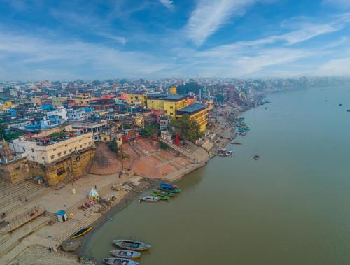 an aerial view of a city next to a river at Amritara Suryauday Haveli in Varanasi