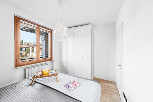 Ein Bett oder Betten in einem Zimmer der Unterkunft La Piopa 2 20 Apartment by Wonderful Italy