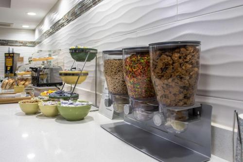 a counter with a bunch of different types of food at Quality Inn Kodak Sevierville in Kodak