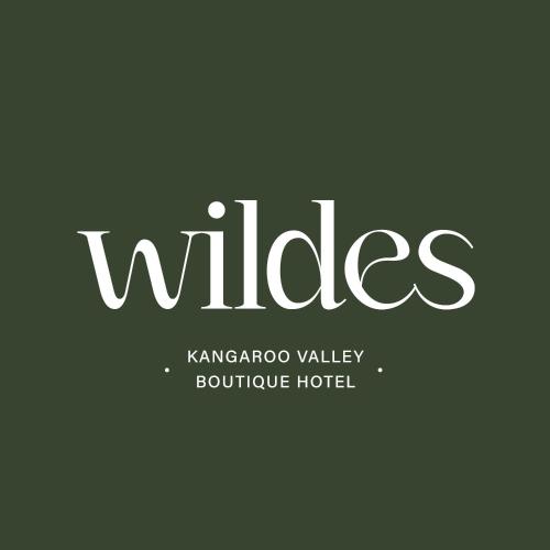 a sign that reads villages kananago valley boutique hotel at Wildes Hotel Kangaroo Valley in Kangaroo Valley