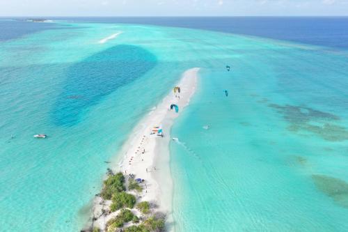 an aerial view of a beach in the ocean at Summer Vibes Beach Front in Rasdu