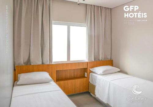 Postel nebo postele na pokoji v ubytování Apto no Salinas Exclusive Resort