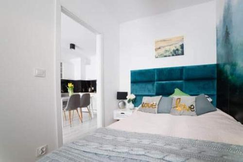 Posteľ alebo postele v izbe v ubytovaní Apartament Hania