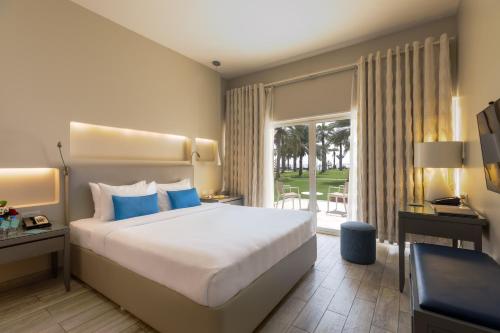 Postel nebo postele na pokoji v ubytování Sealine Beach, a Murwab Resort