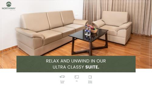 a living room with a couch and a coffee table at Northway Hotel in Visakhapatnam