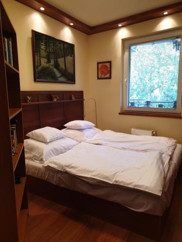 מיטה או מיטות בחדר ב-Beach Club Apartman