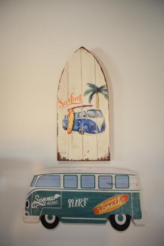 a figurine of a van in front of a window at Largo Bispo Boutique Hostel in Horta