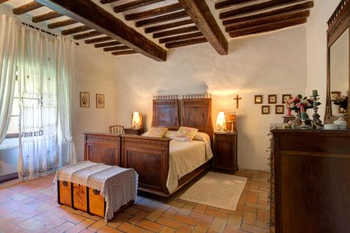 a bedroom with a bed and a large window at Casa di Nonna Nuccia in Fabriano