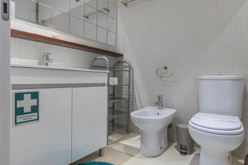 a bathroom with a toilet and a sink at Bright & Comfy Flat in Lisbon by LovelyStay in Lisbon