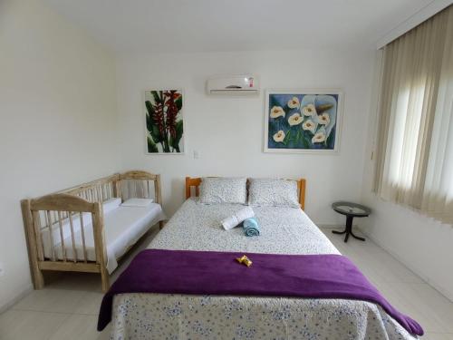 Katil atau katil-katil dalam bilik di Linda Casa de Praia (Morada 3R's) Florianópolis/SC
