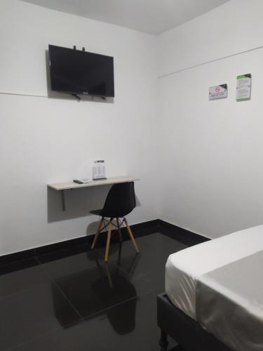 TV a/nebo společenská místnost v ubytování Hotel Aura Medellin