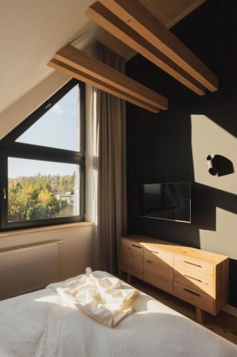 Cama o camas de una habitación en Czarne Wierchy Domy Premium