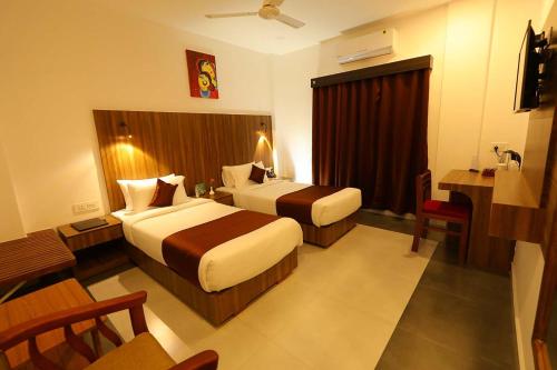 HOTEL LA SERENE Mattannurにあるベッド