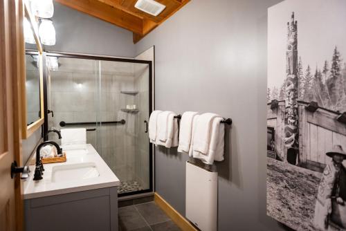 a bathroom with a sink and a shower at Haida House at Tllaal in Tlell