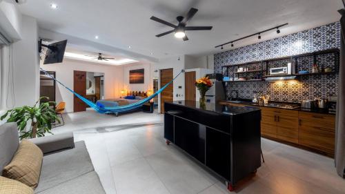 a living room with a hammock in the middle at Casa Makawe ONLY ADULTS in Sayulita