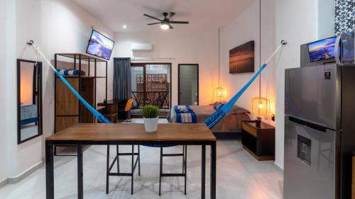 a living room with a table and a couch at Casa Makawe ONLY ADULTS in Sayulita