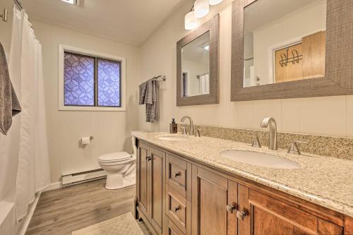 a bathroom with a sink and a toilet at Cozy Poconos Ranch Home with Pool Access, Near Lake! in Gouldsboro