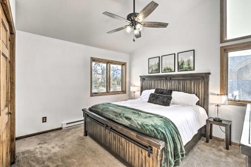 a bedroom with a bed and a ceiling fan at Sunny Alpine Escape with Hot Tub and Mountain Vistas! in Fraser