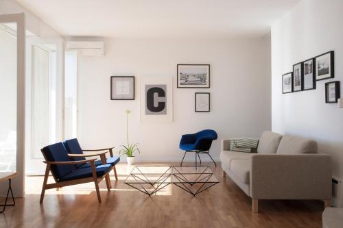 a living room with a couch and chairs at Villa The Spot in Zaostrog