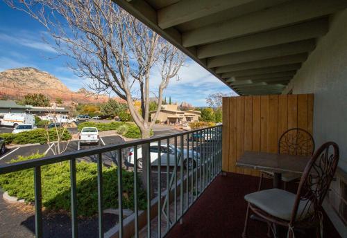 a balcony with a table and chairs and a view at Dreamcatcher Inn of Sedona in Sedona