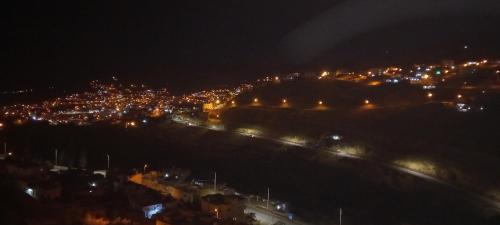 a view of a city at night with lights at Magic view apartment in Wadi Musa