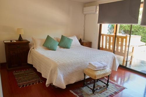 En eller flere senger på et rom på Hostal Aldea Colchagua Experience