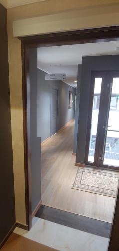 an open door to a hallway in a building at La Piana Hotel in Tito