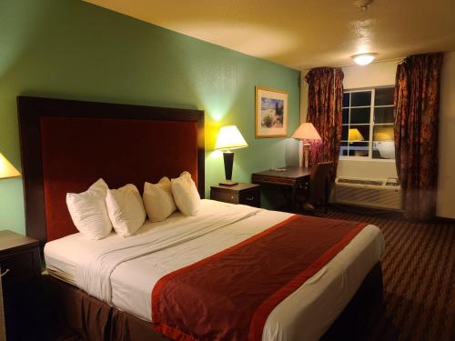 Katil atau katil-katil dalam bilik di Budget host inn