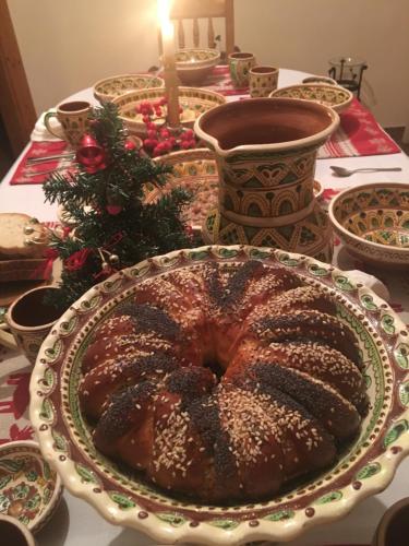 a table topped with a large cake on a plate at Panska Hata in Yaremche
