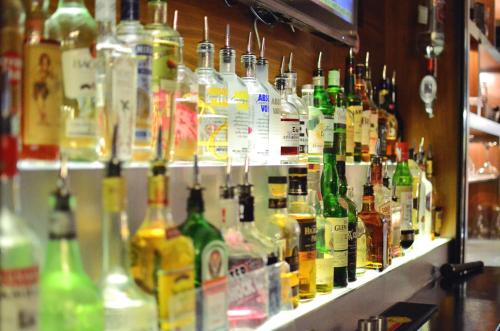 a display of bottles of alcohol on a shelf at a&o Edinburgh City in Edinburgh