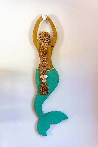 a seahorse shaped decoration on a white wall at Ultramodern Townhome with an Inviting Coastal Design and Lush Outdoor Oasis with a Private Pool in Playa Flamingo