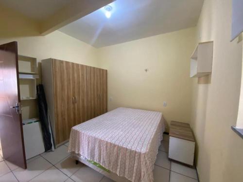Ένα ή περισσότερα κρεβάτια σε δωμάτιο στο Casa de Praia Atalaia