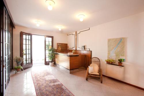 a kitchen with a counter and a chair in a room at Residence le Balze in Malcesine