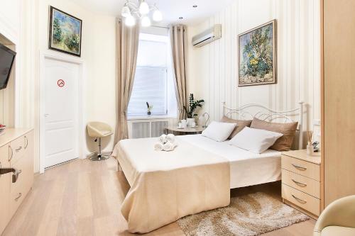 Postel nebo postele na pokoji v ubytování Basseynaya Apart Hotel