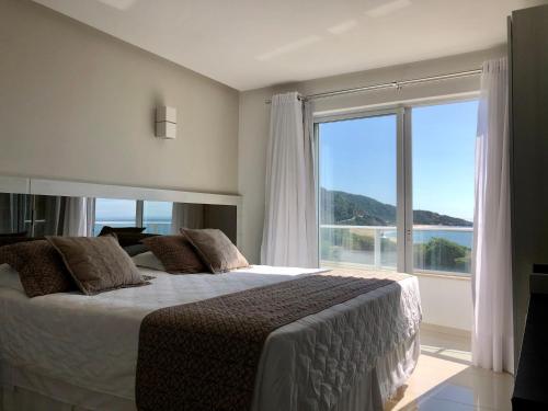 Giường trong phòng chung tại Reserva Praia Hotel