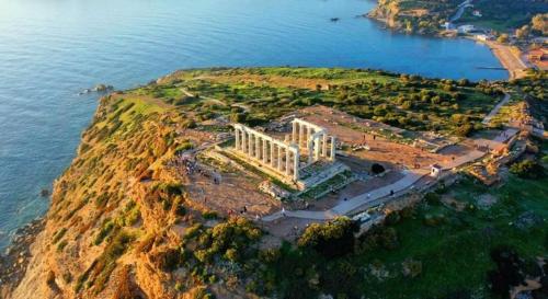 an aerial view of a temple on an island in the water at Amazing Garden House in Athens