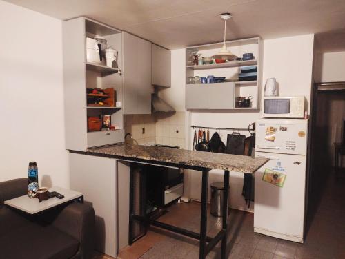 a kitchen with a counter top in a room at Lunita de Alberdi in Cordoba