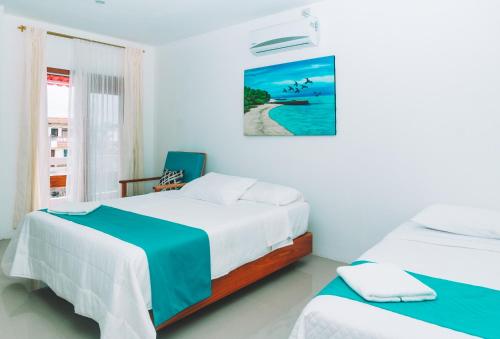 Tempat tidur dalam kamar di Galápagos Isabela Hotel Loja