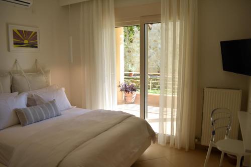 Katil atau katil-katil dalam bilik di Gallery Suites Parga